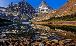 A calm Magog Lake in the early morning