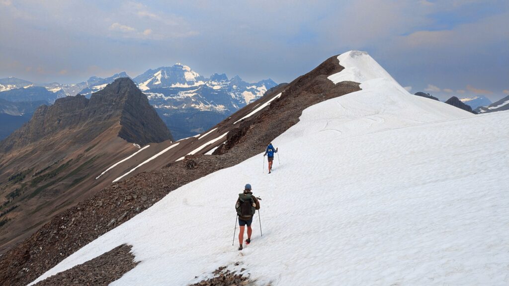 Two hikers traverse snowy Northover Ridge